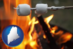 maine map icon and roasting marshmallows on a camp fire