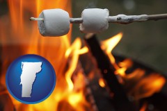 vermont map icon and roasting marshmallows on a camp fire