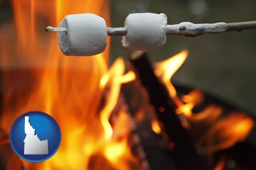 roasting marshmallows on a camp fire - with Idaho icon