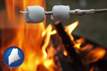 roasting marshmallows on a camp fire - with Maine icon